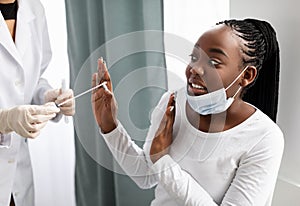 African American woman afraid of coronavirus pcr test