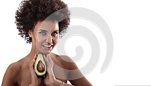 African american woman with afro hairstyle holding avocado
