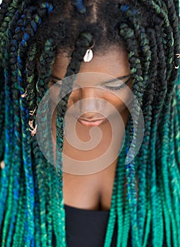 African American Woman with Beautiful Teal Green Blue Braids