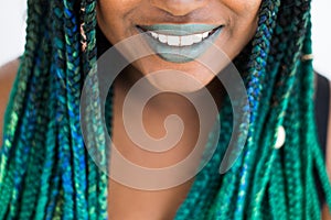 African American Woman with Beautiful Teal Green Blue Braids