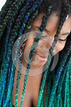 African American Woman with Beautiful Teal Green Blue Braids