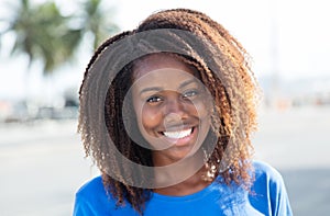 African american woman in a blue shirt outdoor