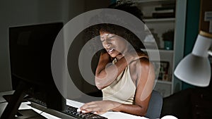 African american woman business worker using computer suffering for cervical pain at the office