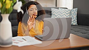 African american woman call center agent having video call working at home