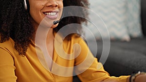 African american woman call center agent smiling working at home