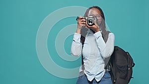 African american woman capturing image with camera