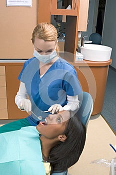 African-American woman and Caucasian dentist