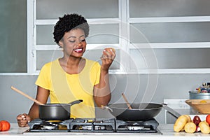 African american woman cooking with tomato