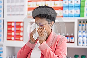 African american woman customer using napkin at pharmacy