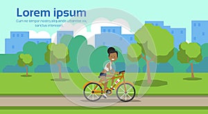 African american woman cycling city park green lawn trees template landscape background copy space horizontal flat