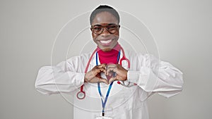 African american woman doctor smiling doing heart gesture with hands over isolated white background