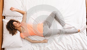 African-american woman enjoying her sleep, top view