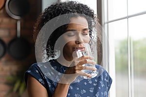 African American woman feel thirsty drinking water