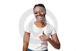 African American Woman Gesturing Thumbs Up Posing Over White Background