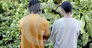 African american woman in grey sweatshirt and man in yellow t shirt, slow motion, copy space