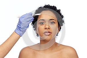 african american woman and hand with scalpel knife