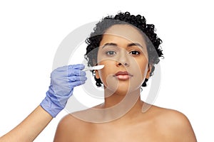 african american woman and hand with scalpel knife
