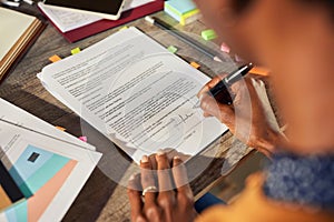 African american woman hand signing buiness contract