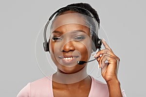 African american woman in headset with microphone