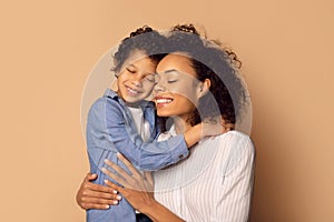 African American Woman Holding a Child in Her Arms