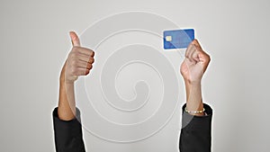 African american woman holding credit card doing thumb up gesture over isolated white background