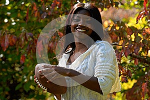 African-American woman holds football