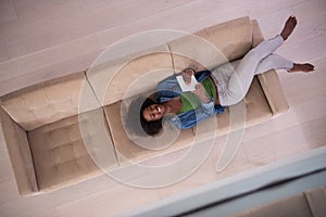African american woman at home with digital tablet top view