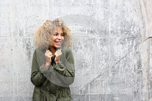 African american woman keeping warm with jacket