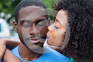 African american woman kissing boyfriend