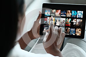 Black Woman Browsing Movie On Streaming Media Service photo