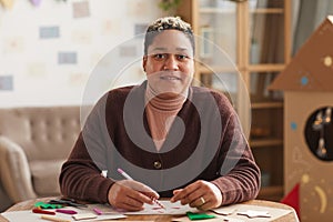 African-American Woman Making Christmas Cards