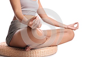 African-American woman meditating on white background, closeup