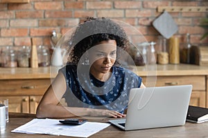 African American woman pay household bills online