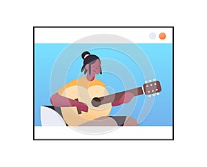 african american woman playing guitar in web browser window online music theory concept portrait