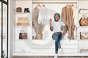 African American Woman Posing In Wardrobe Having Idea Indoor
