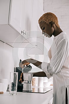 African american woman preparing beverage