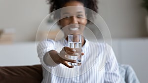 African American woman recommend water for body hydration