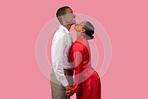 African american woman in red dress adoring man in white shirt