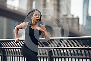 African american woman running in New York City at the morning