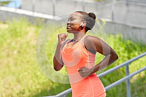 African american woman running outdoors