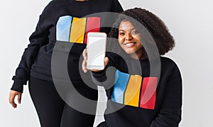 African american woman showing blank phone screen, mockup