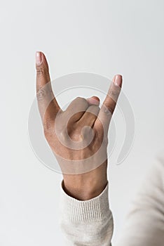 African american woman showing rock sign isolated on white