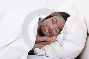 African american woman sleeping in bed