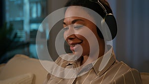 African American woman smiling businesswoman working computer business from home female freelancer enjoy sound in