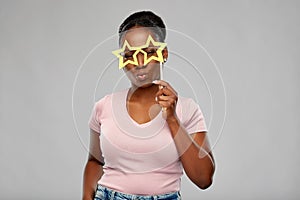 African american woman with star shaped glasses
