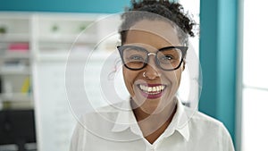 African american woman student smiling confident standing at library university