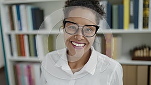African american woman student smiling confident standing at library university