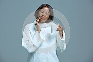 African american woman suffering toothache, sensitive enamel, holding hot drink cup. Dental clinic, medical insurance ad