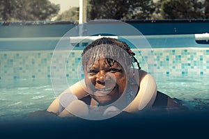 African American woman swimming in the pool