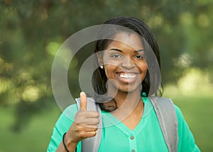 African American woman thumbs up